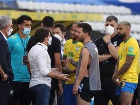 Argentina's Lionel Messi and Brazil's Neymar are seen as play is interrupted after Brazilian health officials objected to the participation of three Argentine players they say broke quarantine rules.