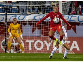 Team Canada's Adriana Leon leaps for the ball during Tuesday's match against New Zealand at Saputo Stadium.