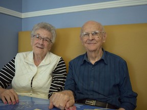 Former teen sweethearts Ross Dilling, 94, and Orene McNaughton, 90, rekindle their friendship at the Early Riser Cafe, where they bumped into each other last month. (Calvi Leon/The London Free Press)