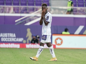 Gloire Amanda of Austria Klagenfurt is dejected after a red card during the Admiral Bundesliga match between Austria Wien and SK Austria Klagenfurt at Generali-Arena on Aug. 15, 2021, in Vienna, Austria. But his experience as a pro in Europe has mostly been a dream.