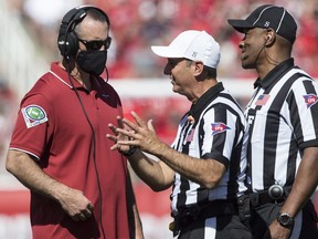 Nick Rolovich, head coach of the Washington State Cougars, talks with officials during their game against the Utah Utes September 25, 2021 at Rice Eccles Stadium in Salt Lake City, Utah.