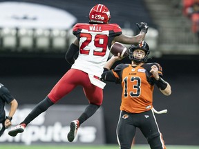 Jamar Wall of the Calgary Stampeders gets in the face of B.C. Lions quarterback Michael Reilly during their Oct. 16 game at B.C. Place Stadium, won 39-10 by the Stamps.