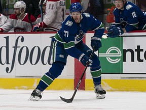 Travis Hamonic #27 of the Vancouver Canucks skates with the puck during NHL hockey action against the Montreal Canadiens at Rogers Arena on January 20, 2021.