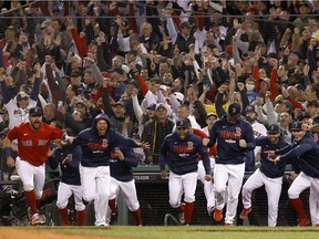 The Boston Red Sox celebrate after beating the New York Yankees 6-2 in the American League Wild Card game at Fenway Park on October 05, 2021 in Boston, Massachusetts.