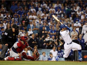 Chris Taylor #3 of the Los Angeles Dodgers hits a walk off two-run home run in the ninth inning to defeat the St. Louis Cardinals 3 to 1 during the National League Wild Card Game at Dodger Stadium on October 06, 2021 in Los Angeles, California.