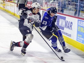 Defenceman Tanner Brown (left, checking Victoria Royal Parker Malchuk last spring) is one of only seven Vancouver Giants on today’s roster who played in front of the home team’s fans at the Langley Events Centre before the COVID pandemic disrupted team sports.