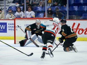 Kelowna Rockets forward 	Rilen Kovacevic fires one at Vancouver Giants netminder Jesper Vikman as Vancouver defender Damian Palmieri goes for the block on Friday.