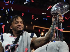 In this file photo taken on February 3, 2019 strong safety for the New England Patriots Patrick Chung holds the trophy after winning Super Bowl LIII against the Los Angeles Rams at Mercedes-Benz Stadium in Atlanta, Georgia.