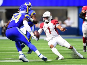 Oct 3, 2021; Inglewood, California, USA; Arizona Cardinals quarterback Kyler Murray (1) runs the ball against Los Angeles Rams outside linebacker Leonard Floyd (54) during the second half at SoFi Stadium. Mandatory Credit: Gary A. Vasquez-USA TODAY Sports