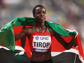 Agnes Jebet Tirop of Kenya celebrates winning bronze in the Women's 10,000 Metres final during day two of 17th IAAF World Athletics Championships Doha 2019 at Khalifa International Stadium on September 28, 2019 in Doha, Qatar.