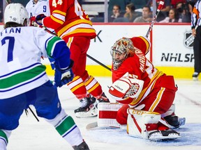 Calgary Flames goalie Jacob Markstrom makes a save against the Vancouver Canucks during the second period at Scotiabank Saddledome.