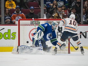 Edmonton Oilers forward Derek Ryan watches a shorthanded shot from forward Kailer Yamamoto (not pictured) go past Vancouver Canucks goalie Thatcher Demko in the second period at Rogers Arena.