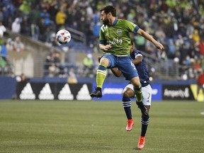 Seattle Sounders FC midfielder Joao Paulo jumps for a header against the Vancouver Whitecaps in the first half at Lumen Field Saturday.