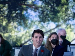Prime Minister Justin Trudeau waits for the start of a meeting about the global supply chain, during the G20 Summit at the Roma Convention Center La Nuvola on Oct. 31, 2021, in Rome, Italy.