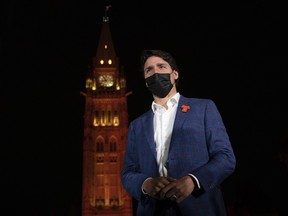 The Peace Tower glows orange as Canadian Prime Minister Justin Trudeau participates in a ceremony on Parliament Hill on the eve of the first National Day of Truth and Reconciliation, Wednesday, September 29, 2021 in Ottawa.
