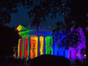 In this file photo taken on June 26, 2015, the White House is lit in pride colors in Washington, DC.