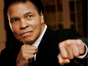 U.S. boxing great Muhammad Ali poses during the Crystal Award ceremony at the World Economic Forum (WEF) in Davos, Switzerland, in this January 28, 2006 photo.