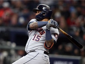 Houston Astros catcher Martin Maldonado (15) hits an RBI double against the Atlanta Braves during the seventh inning of game five of the 2021 World Series at Truist Park.