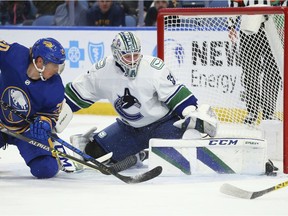 Buffalo Sabres forward Cody Eakin (20) is stopped by Vancouver Canucks goalie Thatcher Demko (35) during the first period of an NHL hockey game Tuesday, Oct. 19, 2021, in Buffalo, N.Y.