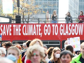 People take part in a climate march in Belgium ahead of the COP26 climate summit in Glasgow next week.