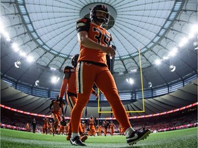 B.C. Lions' Jimmy Camacho walks to the locker-room after warming-up before a CFL game against the Ottawa Redblacks in Vancouver on Sept. 11.