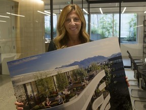 Amela Brudar, principal at GBL Architects, holds a preliminary drawing of the project in her company's Vancouver offices.