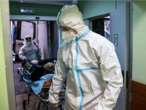 Medical specialists transport a patient at the City Clinical Hospital Number 52, where people suffering from the coronavirus disease (COVID-19) are treated, in Moscow, Russia October 21, 2021.