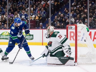 Vancouver Canucks' Alex Chiasson (39) scores against Minnesota Wild goalie Cam Talbot (33) during the second period of an NHL hockey game in Vancouver, on Tuesday, October 26, 2021.