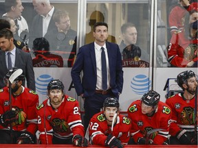 Chicago Blackhawks head coach Jeremy Colliton looks on from the bench during the first period of a NHL game against the Vancouver Canucks at United Center on Oct. 21.