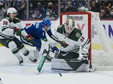 Oct 26, 2021; Vancouver, British Columbia, CAN; Minnesota Wild goalie Cam Talbot (33) makes a save against the Vancouver Canucks in the first period at Rogers Arena. Mandatory Credit: Bob Frid-USA TODAY Sports