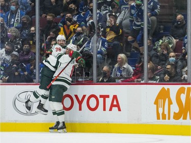 Minnesota Wild forward Mats Zuccarello (36) and forward Joel Eriksson Ek (14) celebrate Zuccarello's goal against the Vancouver Canucks in the first period at Rogers Arena.