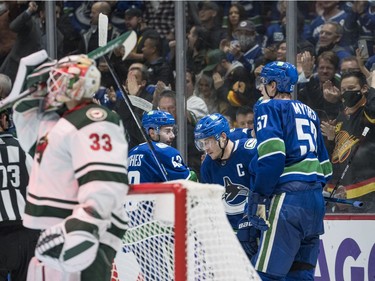 Oct 26, 2021; Vancouver, British Columbia, CAN; Vancouver Canucks defenseman Quinn Hughes (43) and forward Bo Horvat (53) and defenseman Tyler Myers (57) celebrate Horvat's goal against the Minnesota Wild in the  third period at Rogers Arena. Mandatory Credit: Bob Frid-USA TODAY Sports