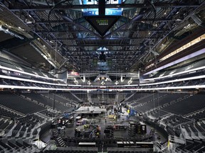 The floor and seating areas of Climate Pledge Arena are shown Wednesday, Oct. 20, 2021, during a media tour ahead of the NHL hockey Seattle Kraken's home opener Saturday against the Vancouver Canucks in Seattle. The historic angled roof of the former KeyArena was preserved, but everything else inside the arena, which will also host concerts and be the home of the WNBA Seattle Storm basketball team, is brand new.