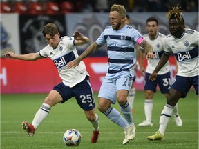 Whitecap Ryan Gauld (left) challenges Sporting KC’s Johnny Russell during their game last month at B.C. Place Stadium. ‘We were well aware of Gauldy coming through the youth, and it was just a matter of time before he got into the first team,’ Russell recalls of the time in their native Scotland a decade ago with Dundee United.