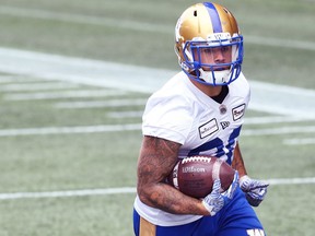 Brady Oliveira carries the ball during Winnipeg Blue Bombers practice on Tues., Oct. 19, 2021. KEVIN KING/Winnipeg Sun/Postmedia Network