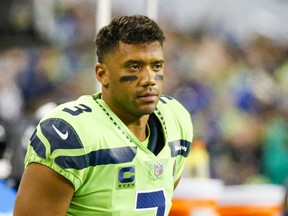 Seattle Seahawks quarterback Russell Wilson stands on the sideline during the fourth quarter against the Los Angeles Rams at Lumen Field.