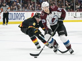 J.T. Miller and the Canucks won't be tasked with chasing the explosive Nathan MacKinnon when they face Colorado Thursday night in Denver. The dynamic forward is out several weeks with a lower-body injury.