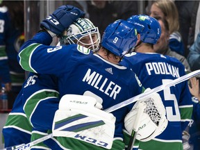 Hugs all around for Thatcher Demko, who has faced the most shots and played the most minutes of any NHL goaltender.