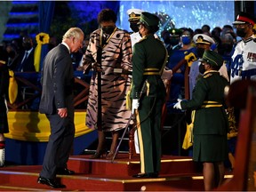 BRIDGETOWN, BARBADOS - NOVEMBER 30:  Prince Charles, Prince of Wales receives the Freedom of Barbados award from President of Barbados, Dame Sandra Mason during the Presidential Inauguration Ceremony at Heroes Square on November 30, 2021 in Bridgetown, Barbados. The Prince of Wales arrived in the country ahead of its transition to a republic within the Commonwealth. This week, it formally removes Queen Elizabeth as its head of state and the current governor-general, Dame Sandra Mason, will be sworn in as president.