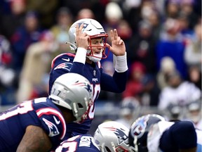 Mac Jones #10 of the New England Patriots calls out the play against the Tennessee Titans during their game at Gillette Stadium on November 28, 2021 in Foxborough, Massachusetts.