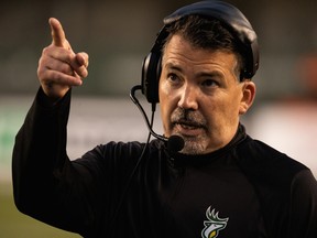 Edmonton Elks head coach/offensive co-ordinator/quarterbacks coach Jaime Elizondo guides his team against the Calgary Stampeders at Commonwealth Stadium in Edmonton on Saturday, Sept. 11, 2021.