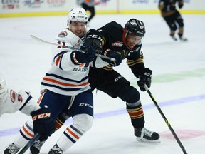 Kamloops Blazer centre Logan Stankoven battles with Vancouver Giants centre Justin Sourdif during Kamloops' 2-1 win over Vancouver at the LEC on Saturday, Nov. 13.