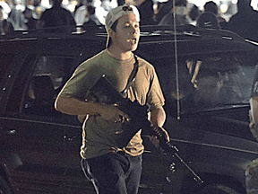 Then-17-year-old Kyle Rittenhouse carries a weapon on the night he fatally shot two protesters and injured a third in Kenosha, Wisconsin, on Aug. 25, 2020.