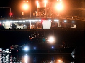 This photograph taken on November 24, 2021 shows a French volunteer sea rescue organisation Societe Nationale de Sauvetage en Mer (SNSM) boat carrying bodies of migrants arriving at Calais harbour after 27 migrants died in the sinking of their boat off the coast of Calais.