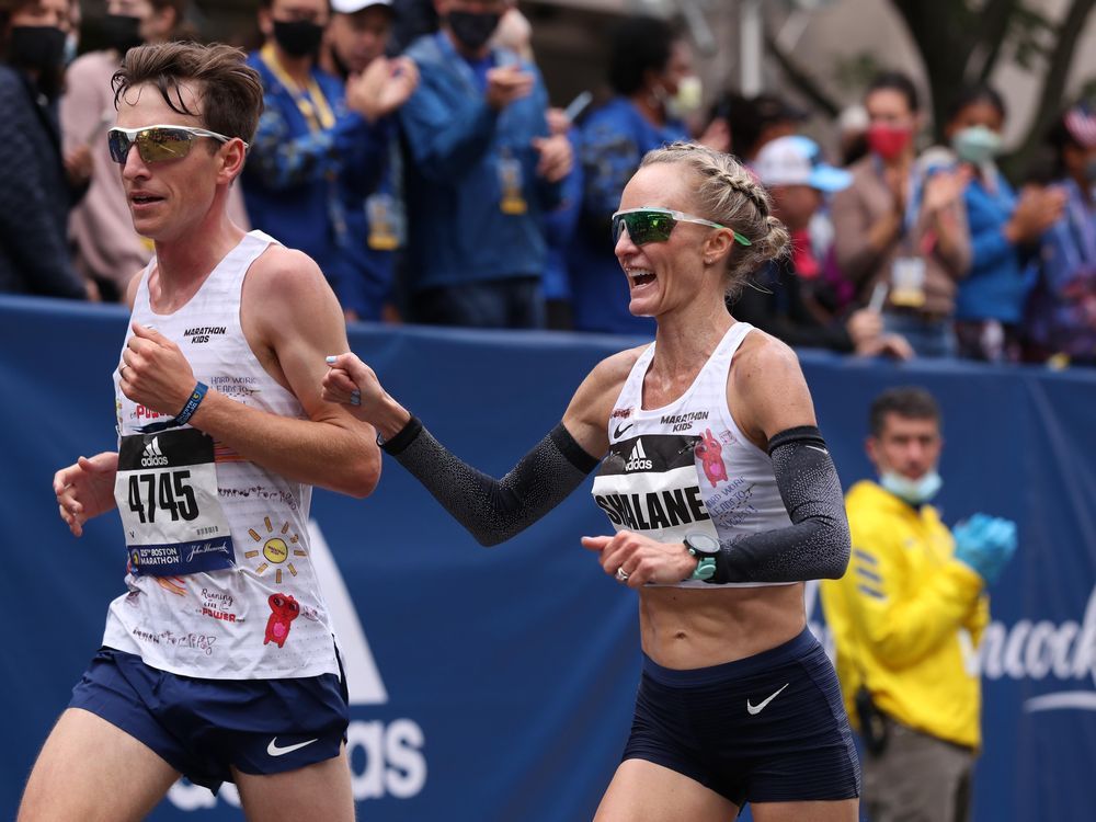Shalane Flanagan crosses the finish line during the 2021 Boston Marathon. 