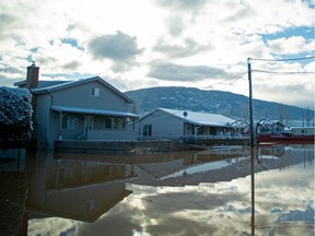 Flood waters cover a neighbourhood a day after severe rain prompted the evacuation of the city of 7,000 in Merritt on Nov. 16.