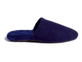 ‘Ines’ shearling slide in navy, $207 at TKEES, tkees.com.