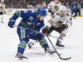 Canucks captain Bo Horvat, in action against the Chicago Blackhawks during the 2019-20 NHL season, says experiences like the Blackhawks’ mishandling of Kyle Beach’s abuse case points to the need for teams — players and management alike — to step up and sympathetically address the concerns of all players. ‘It's really important that people … are willing to help right away instead of just letting it sit and linger,’ he says.