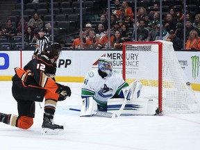 Anaheim Ducks left wing Sonny Milano (12) scores a goal past Vancouver Canucks goaltender Jaroslav Halak (41) during the second period at Honda Center.