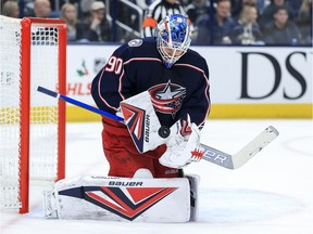 Columbus Blue Jackets' Adam Boqvist gets set to shoot against Vancouver Canucks goalie Thatcher Demko during second-period NHL action on Nov. 26 in Columbus, Ohio.